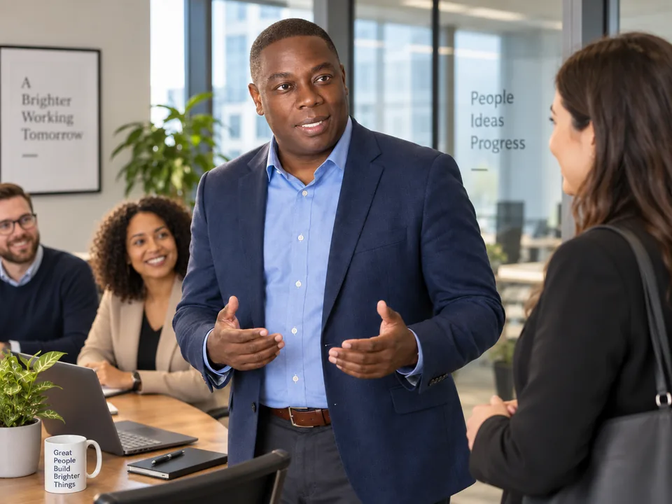 Business leader speaking with colleagues during an office discussion